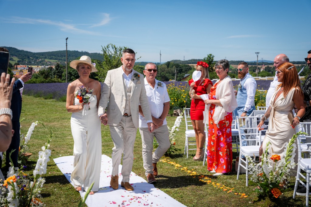 Walking back down the white aisle together after the ceremony