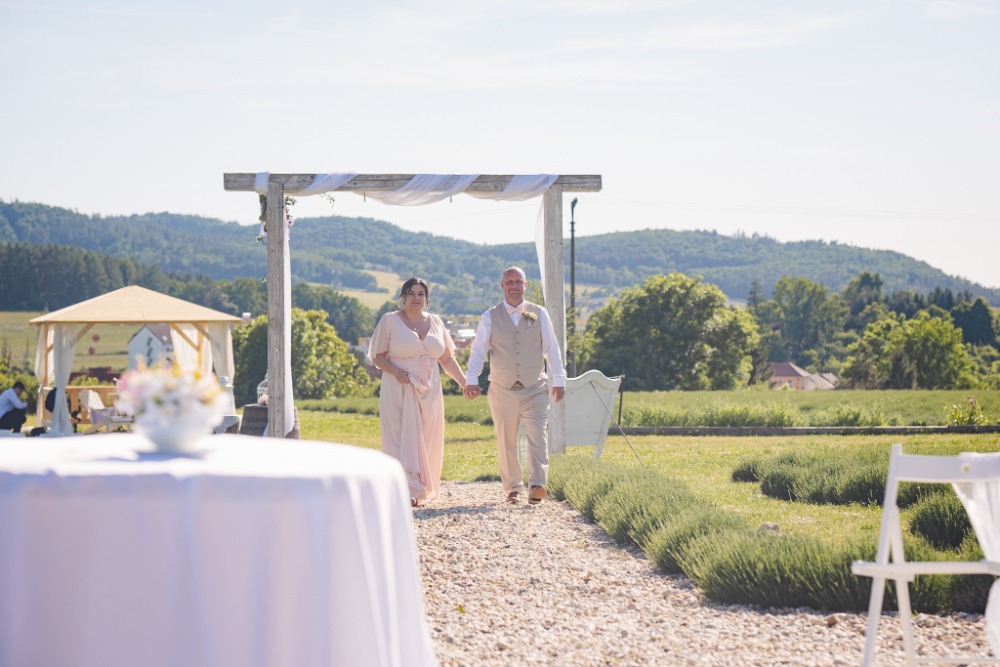 Walking down the gravel path from the ceremony arch
